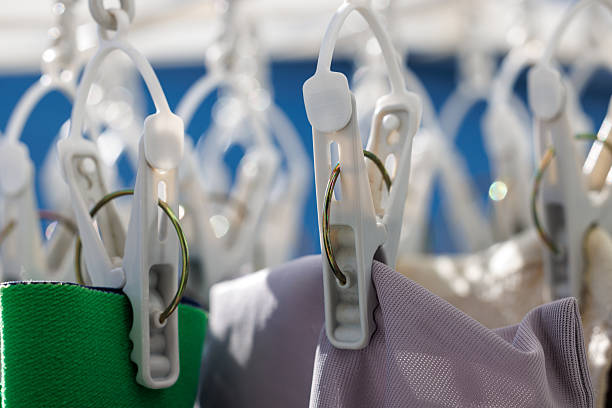 istock Hanging out laundry on a sunny day, laundry and clothespins 2250067578