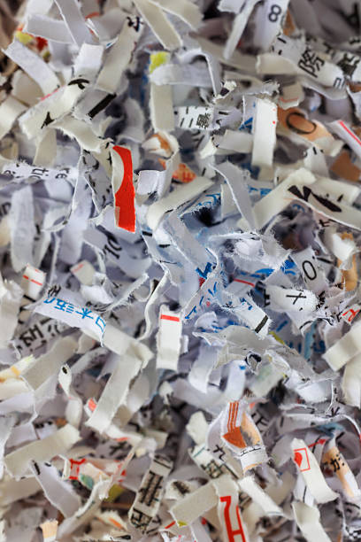 istock Paper cut into small pieces by a shredder 2250067591