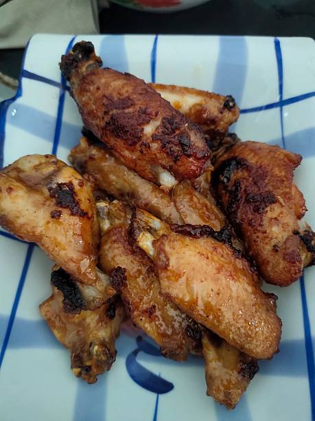 istock Cooked savory chicken wings glistening with marinade 2250067984