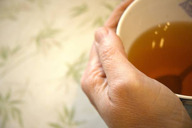 istock Hot Tea in Mug with Spoon Close-Up 2250075002