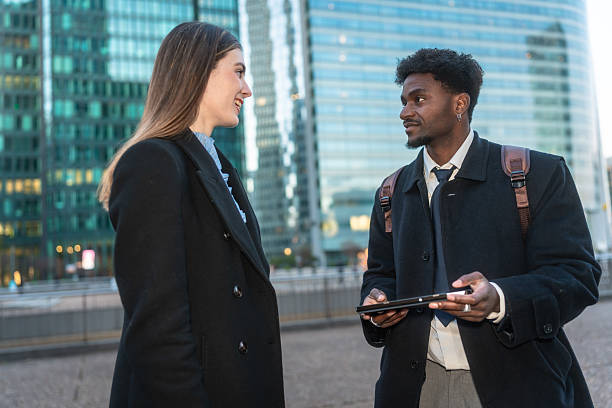 istock Business colleagues having outdoor conversation in city setting 2250078135
