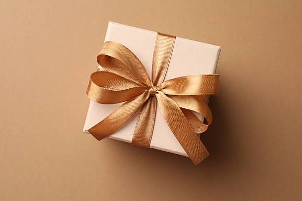istock Gift box with beautiful bow on beige background, top view 2250079840
