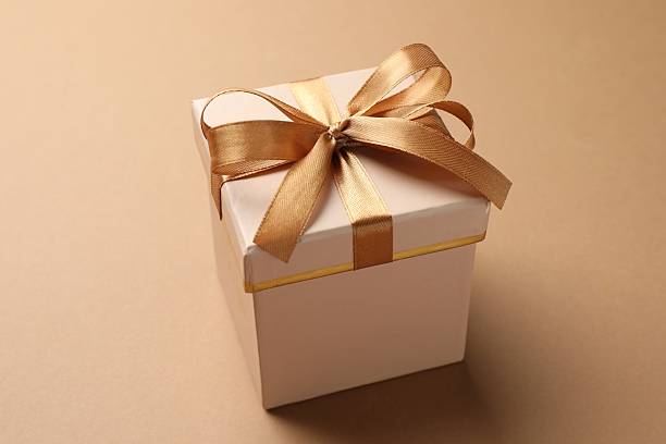 istock Gift box with beautiful bow on beige background, closeup 2250079848