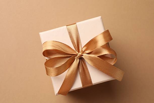 istock Gift box with beautiful bow on beige background, top view 2250079855