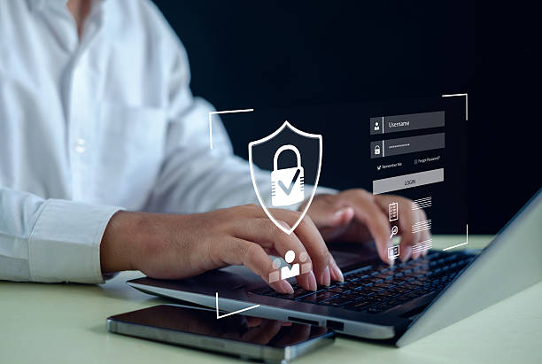 istock Cybersecurity login protection concept showing hands typing on laptop with a virtual shield, secure password interface, and data access control for safe authentication in modern digital environments. 2250080373