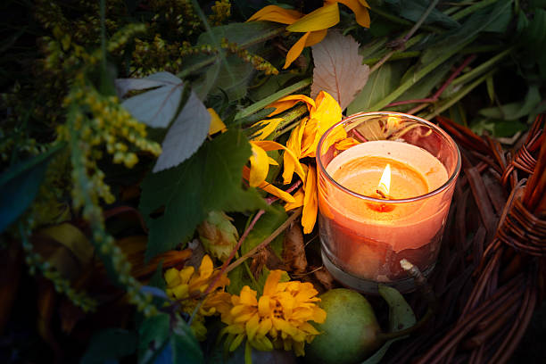 istock Warm glow enhances peaceful evening, Rustic scene illuminated by gentle amber flames atmosphere, Basket with candles and flowers creates calming seasonal setting 2250080407