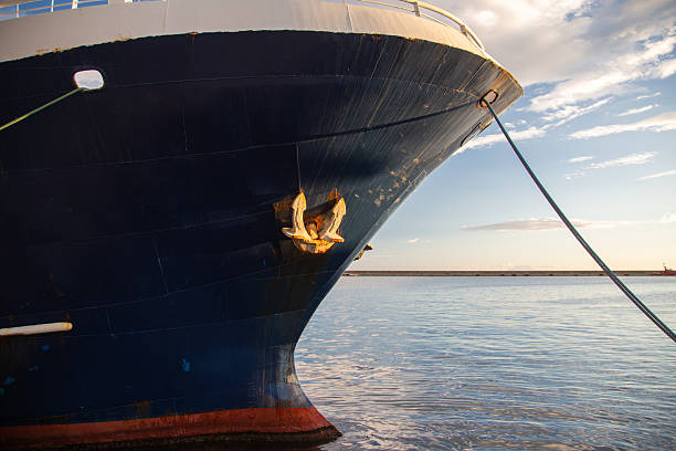 A steel anchor stored on a large cargo ship.
