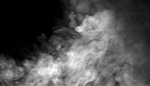 istock Dense white smoke drifting on a dark background creates a dramatic atmospheric texture, ideal for design overlays, cinematic effects, and creative compositions needing mist, fog, or vapor elements. 2250084613