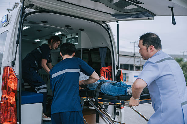istock Asian Emergency Medical Team Loading Patient Into Ambulance 2250087198