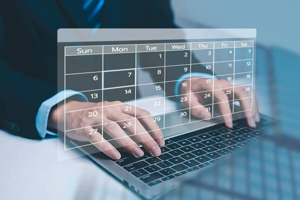istock A business professional typing on a laptop with an overlay digital calendar interface, representing scheduling, planning, productivity management, and modern workflow organization in the workplace. 2250087834