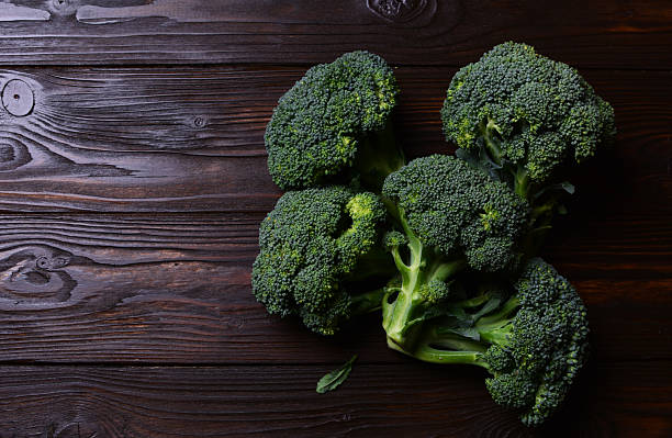 istock Fresh broccoli on a wooden background 2250095992