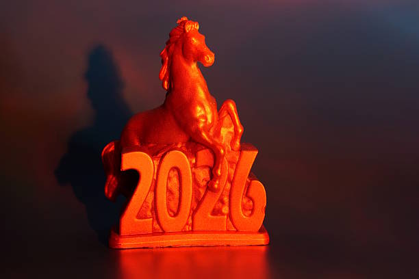 A horse figurine with the number 2026 on a colored background.