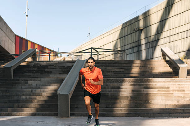 istock Young man running outdoors in morning 2250103375