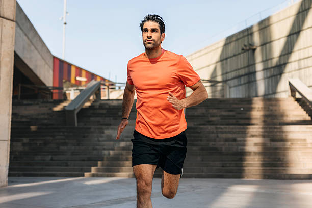 istock Young man running outdoors in morning 2250103391