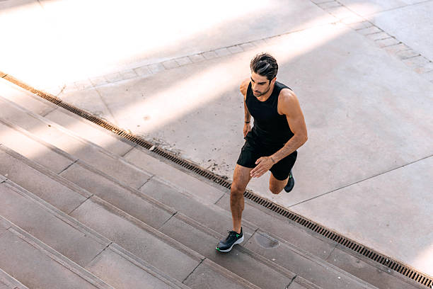 istock Young man running up stairs outdoors in the morning 2250103978