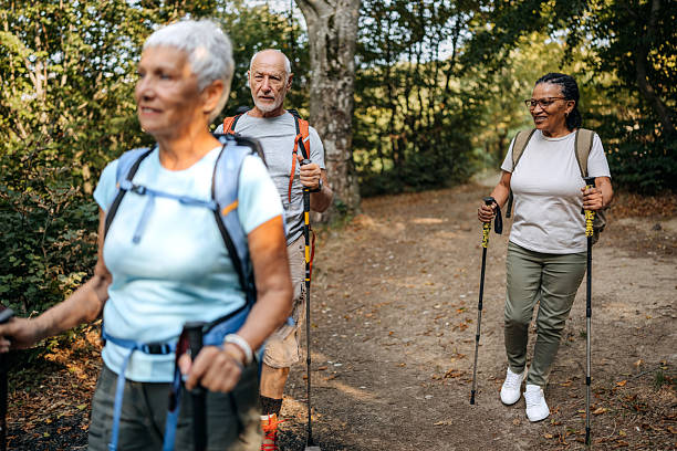 istock Three senior friends hiking together 2250105041