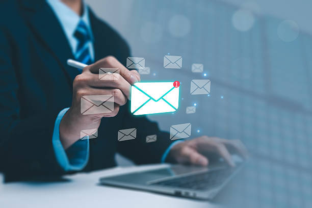 istock A business professional using a laptop and interacting with a glowing email icon, symbolizing digital communication messaging, corporate connectivity, and modern information exchange in the workplace. 2250107749