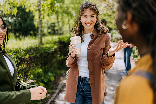 istock Group of students spending time together at a public park 2250107812