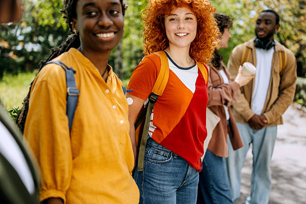 istock Group of students spending time together at a public park 2250108211