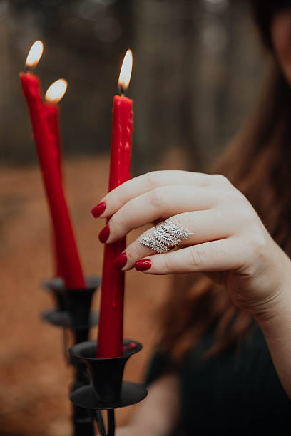 istock Woman Holding Red Candles – Ritual Theme 2250108778