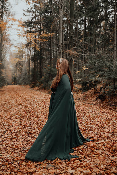 istock Woman Holding Lantern in Forest 2250108970