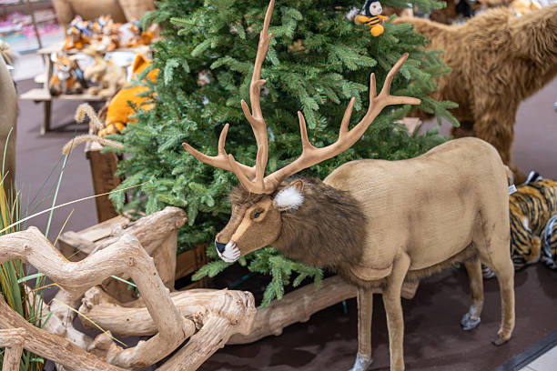 istock Decorative stag with large antlers in a winter display. 2250110482