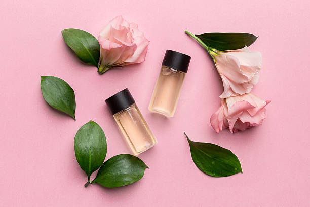 istock Composition with cosmetic products and beautiful roses on color background. Flat lay 2250114375