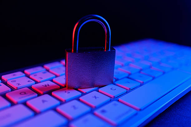 istock Cyber security lock on keyboard with blue and red lighting at night 2250114870
