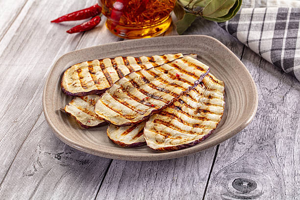 istock Vegan cuisine - grilled eggplant slices 2250116493
