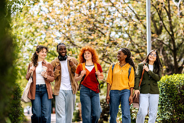 istock Group of students spending time together at a public park 2250116749