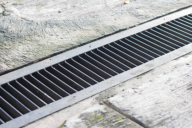 istock Metal Drainage Grate on Outdoor Pavement Surface 2250122606