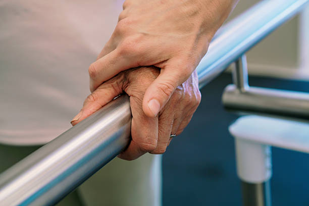 istock Elderly Hand Gripping Rail During Rehabilitation Therapy 2250124566