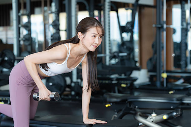 istock Young woman training in the gym 2250124654