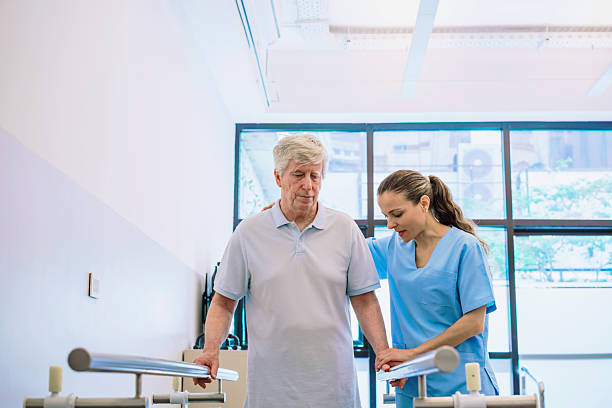 istock Physiotherapist Assists Senior Patient During Rehabilitation 2250128989