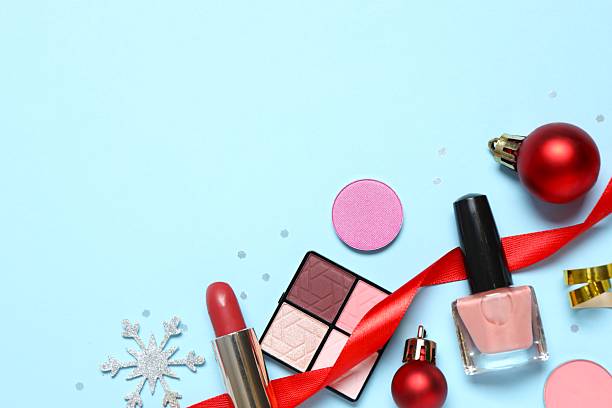 istock Flat lay composition with makeup products and Christmas decor on color background 2250129011