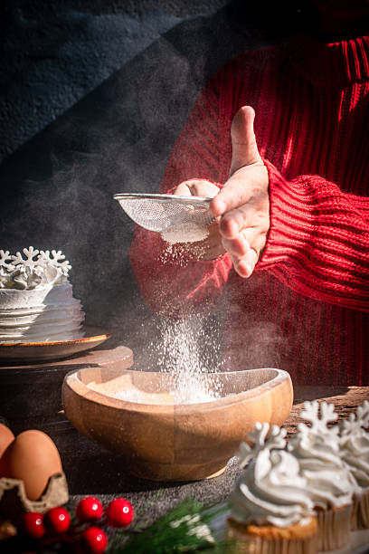 istock Red Sweater Christmas Baking Flour Sifting 2250130858