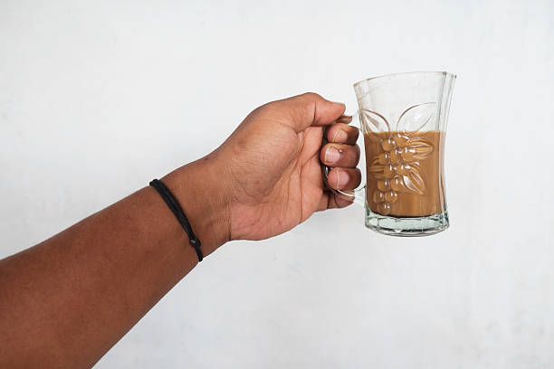 istock Close-Up of Hands Cradling Milk Coffee 2250131921