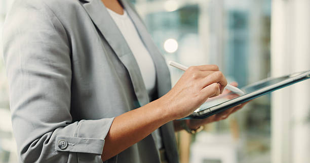 istock Hands, person and stylus with tablet in office for research, editing article and update draft. Journalist, writing and digital for breaking news, proofreading and confirm submission for publication 2250132290