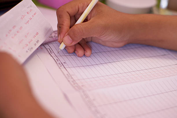 istock Close Up of Hand Writing Daily Planner 2250132925