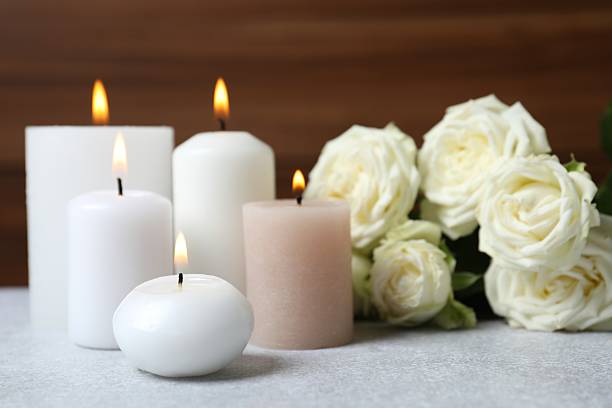 istock Aroma candles on the table with white roses 2250134189