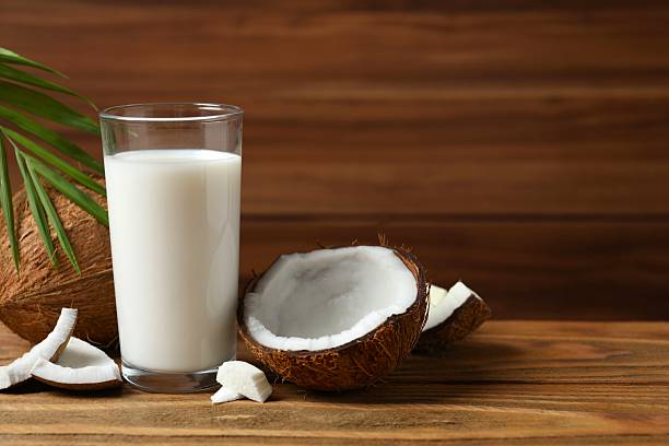 istock Glass of milk with coconuts on the table 2250134785