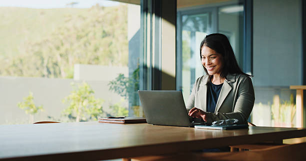 istock Freelancer, woman and happy with laptop in home for editor feedback, article approval or submission. Remote work, journalist or space with tech for story review, fact checking or publication accuracy 2250136046