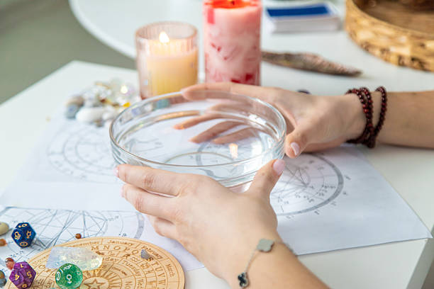 istock Ceromancy wax divination ritual with astrological charts, crystals, and runes on a table 2250136270