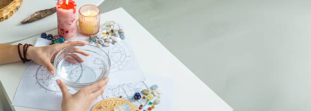 istock Ceromancy wax divination ritual with astrological charts, crystals, and runes on a table 2250136281