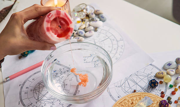 istock Ceromancy wax divination ritual with astrological charts, crystals, and runes on a table 2250136284