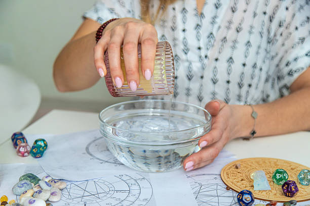 istock Ceromancy wax divination ritual with astrological charts, crystals, and runes on a table 2250136304