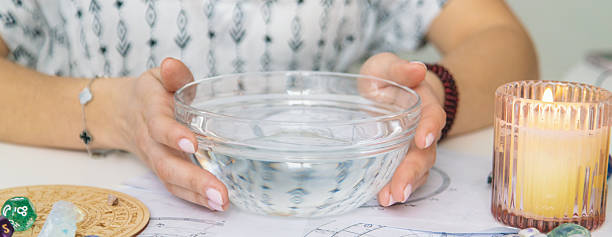 istock Ceromancy wax divination ritual with astrological charts, crystals, and runes on a table 2250136318