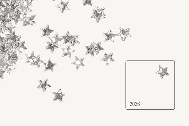 istock Silver star shaped sequins scattered on a light minimal background with one isolated star inside 2250136802