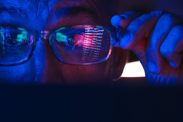 istock Trader analyzing stock market data reflecting in glasses 2250137255