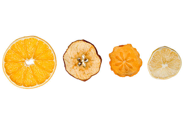 Dried orange, apple, persimmon and lemon slices isolated on white background with clipping path